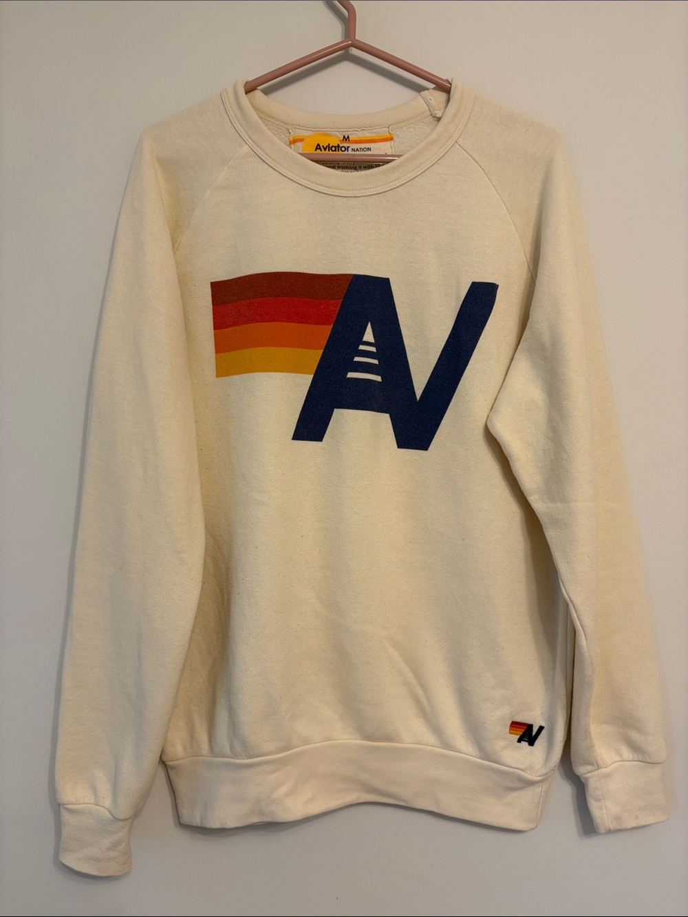 Aviator Nation Cream Crewneck with Navy AV Logo and Red-Orange-Yellow Stripe